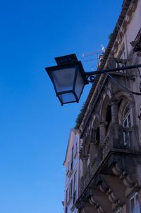 Low angle view of building against clear blue sky
