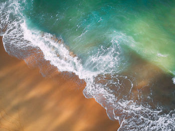 Sea waves splashing on shore