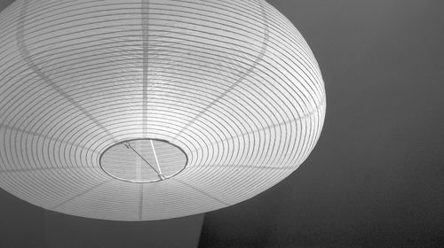 Low angle view of electric lamp against ceiling