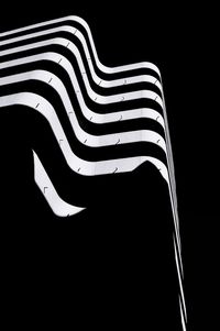 Low angle view of abstract against black background