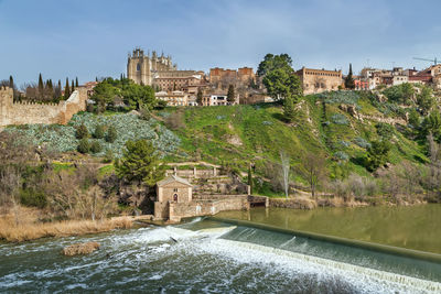 View of monastery of san juan de los reyes  from tagus river, toledo, spain