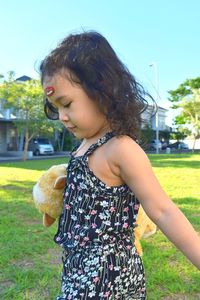 Cute girl standing on field