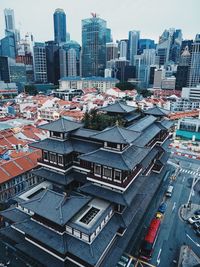 High angle view of buildings in city against sky