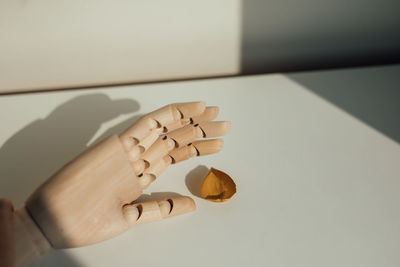 High angle view of human hand on table