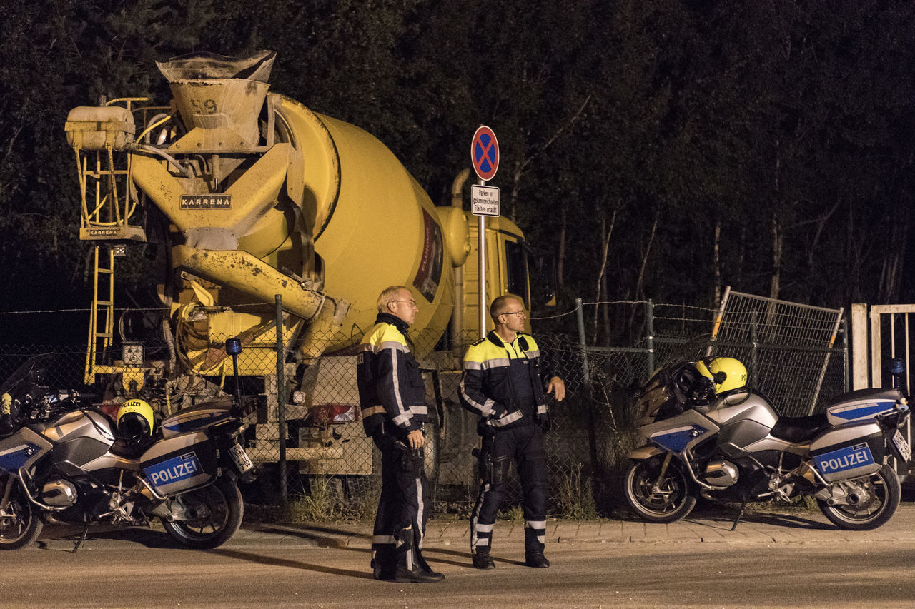 BICYCLES STANDING ON ROAD