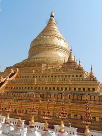 Low angle view of temple building against clear sky