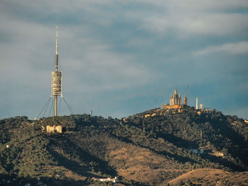 Torre de collserola on mountain against sky