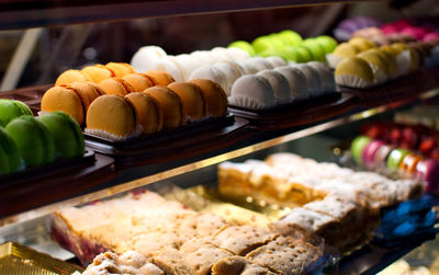 Close-up of food for sale. macarons, coloeful.