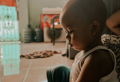 Portrait of boy looking at home