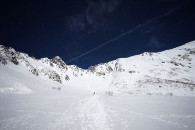 Scenic view of snowcapped mountain against sky