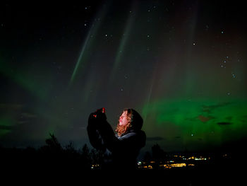 Rear view of woman at music concert
