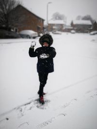 Full length of girl on snow field