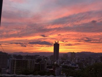 Buildings against sky during sunset