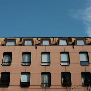 Low angle view of building against blue sky