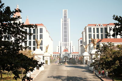 Street amidst buildings against sky