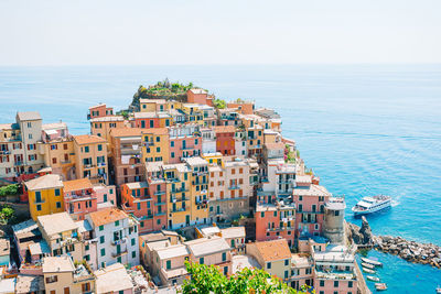 High angle view of buildings against sea