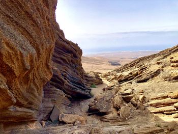 Scenic view of rock formation against sky