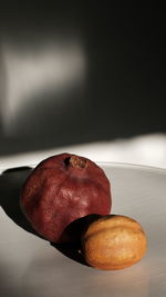 Close-up of apple on table against black background