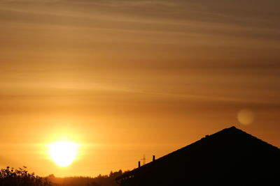 Scenic view of silhouette landscape against sky during sunset