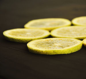 Slices of citrus fruit on table