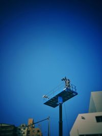 Low angle view of built structure against clear blue sky