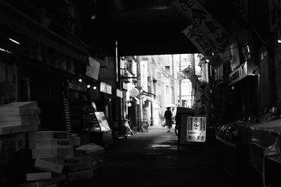 Street amidst buildings in city at night