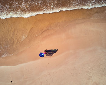 High angle view of woman on shore at beach