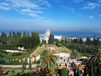 Panoramic view of trees and buildings against sky