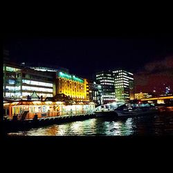 Reflection of illuminated buildings in water