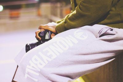 Cropped image of woman holding cigarette