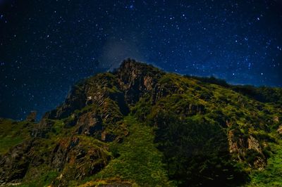 Low angle view of mountain against sky at night