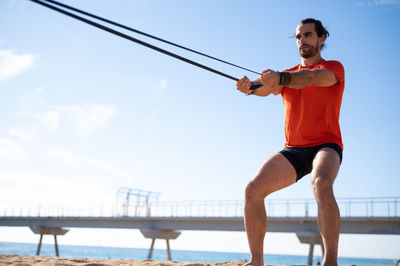 Rear view of woman exercising on stage