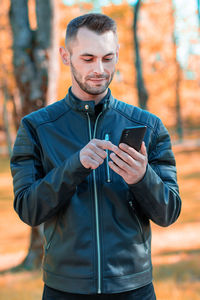 Young man using mobile phone