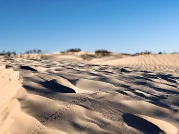 Scenic view of desert against clear sky