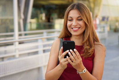 Young woman using mobile phone