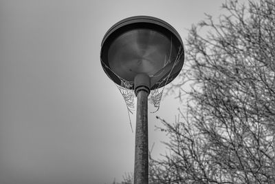 Low angle view of street light against sky