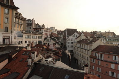 Buildings in city against clear sky