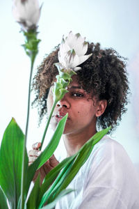 Close-up portrait of woman with flowers