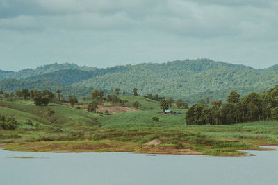 Scenic view of landscape and mountains against sky