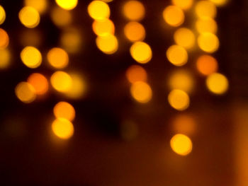 Defocused image of illuminated lights at night