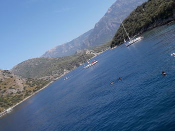 High angle view of sailboats in sea against sky