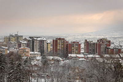 High angle view of buildings against sky during winter