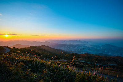 Scenic view of landscape against sky during sunset