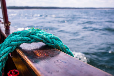 Close-up of rope tied on wooden post