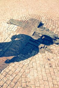 Shadow of people on tiled floor