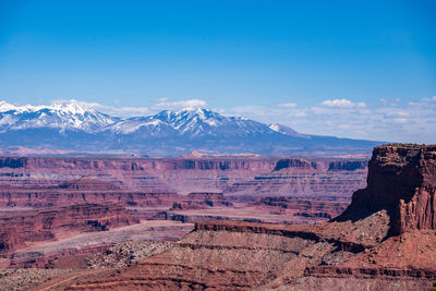 View of landscape with mountain range in background