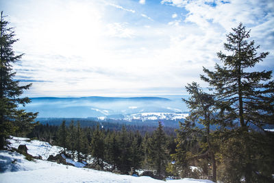 Scenic view of snow covered mountains against sky