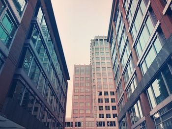 Low angle view of skyscrapers against sky