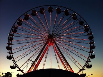 Low angle view of ferris wheel against sky