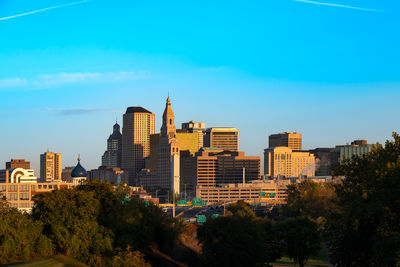 Buildings in city against sky
